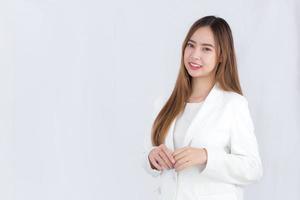 Portrait of asian businesswoman in white suit isolated on white background photo