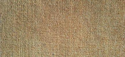 Orange brown close up fleece carpet patterns. photo