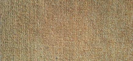 Orange brown close up fleece carpet patterns. photo