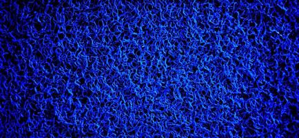 A blue curly fiber carpet.