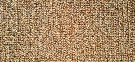 Orange brown close up fleece carpet patterns. photo