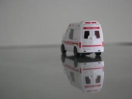 Ambulance Emergency Model white color car on mirror table reflection photo