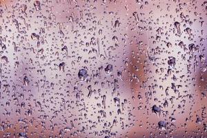 raindrops on the window in rainy days, abstract background photo