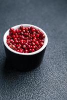 pink peppercorn allspice pepper  spice meal food on the table copy space food photo