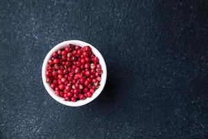 pink peppercorn allspice pepper  spice meal food on the table copy space food photo