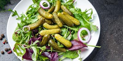 gherkins salad cucumber salty green leaves mix fresh meal food diet snack on the table copy space photo