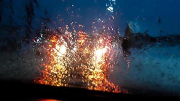 Car lights through wet glass photo