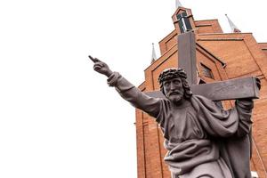 Jesus Christ points the direction with his hand on a white background photo