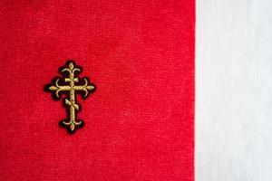 Orthodox cross on a red and white background photo