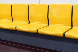 Bright yellow seats on the train photo