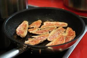 frying red mullet fish fillets photo