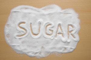 palabra azúcar escrita en azúcar foto