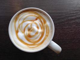 caramel latte in coffee cup photo