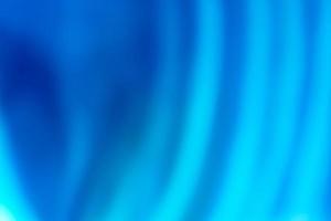 Abstract blue background from a heavily blurred curtain. photo