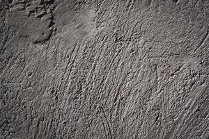 Textured concrete surface. Roughly plastered wall.