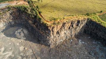 High angle view of a layered rock face seen on a quarry in Brazil. photo