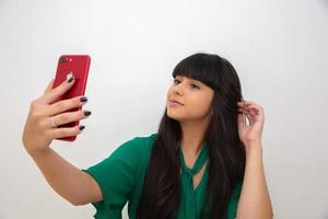 Self portrait of nice, amazing, pretty, positive, sexy woman shooting selfie on front camera photo