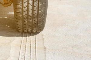 Tire trail in the sand of dunes on the beach or desert. photo