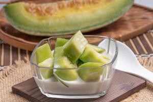 Summer dessert with Thai melon, fruit, and coconut milk. photo