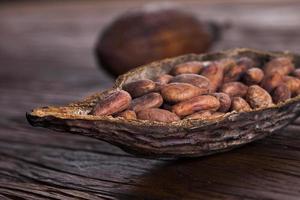 Cocoa pod on wooden table photo