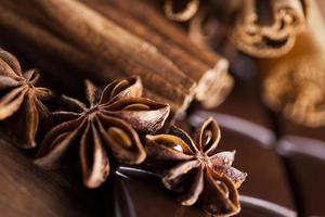 Cinnamon and anise, Dark chocolate with candy sweet photo