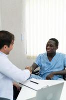 A hospital doctor is examining the symptoms of an inpatient photo