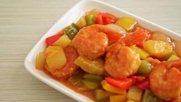 Stir-fried sweet and sour with fried shrimp on plate - Asian food style video