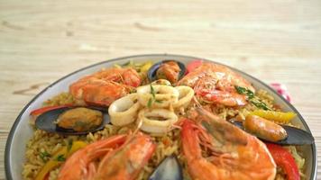 Seafood Paella with prawns, clams, mussels on saffron rice - Spanish food style video