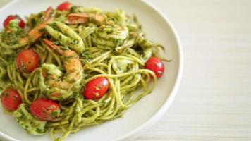 Spaghetti with seafood in homemade pesto sauce - Healthy food style