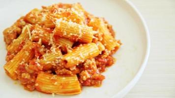 Bolognese rigatoni pasta with cheese - traditional Italian pasta video