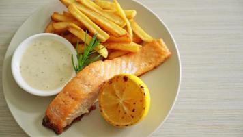 fried salmon fish and chips with lemon on plate video