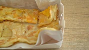 fried roti with egg and sweetened condensed milk video