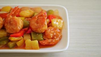 Stir-fried sweet and sour with fried shrimp on plate - Asian food style video