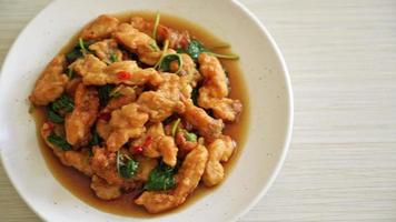 stir-fried fried fish with basil and chili in thai style - Asian food style video