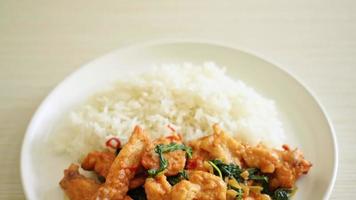 stir-fried fried fish with basil and chili in thai style topped on rice - Asian food style video