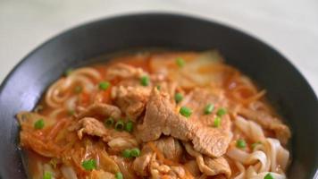 Korean udon ramen noodles with pork in kimchi soup - Asian food style video