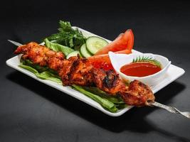 Chicken thigh barbecue with sauce photo