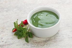 Green chili pepper and lime sauce photo