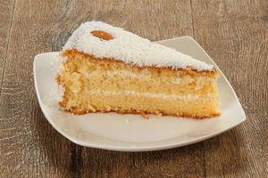 Sweet coconut cake with cream photo