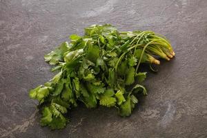 Fresh green Coriander leaves heap photo