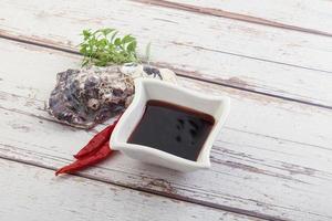 Chinese cuisine - oyster sauce served shell photo