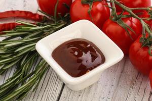 Tomato barbecue sauce on the bowl photo