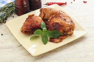 Roasted chicken leg with spicy sauce photo