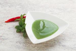 Green chili pepper and lime sauce photo