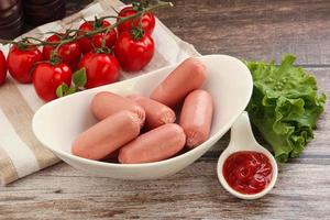 Mini baby sausages for breakfast photo