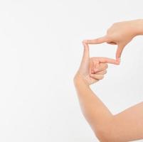 Female hands framing comosition. Isolated on white background. Copy space. Mock up. photo