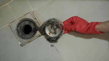 Drain cleaning. Clogged and dirty sewer pipes floor drain. photo