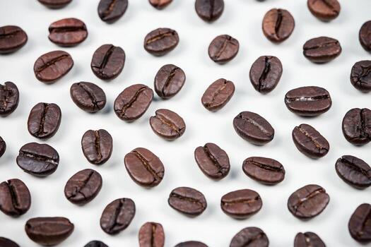 Letter of CAFFEINE arranged with coffee beans on wood background with some space for your text photo