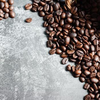 Letter of CAFFEINE arranged with coffee beans on wood background with some space for your text photo