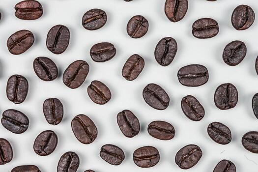 Letter of CAFFEINE arranged with coffee beans on wood background with some space for your text photo